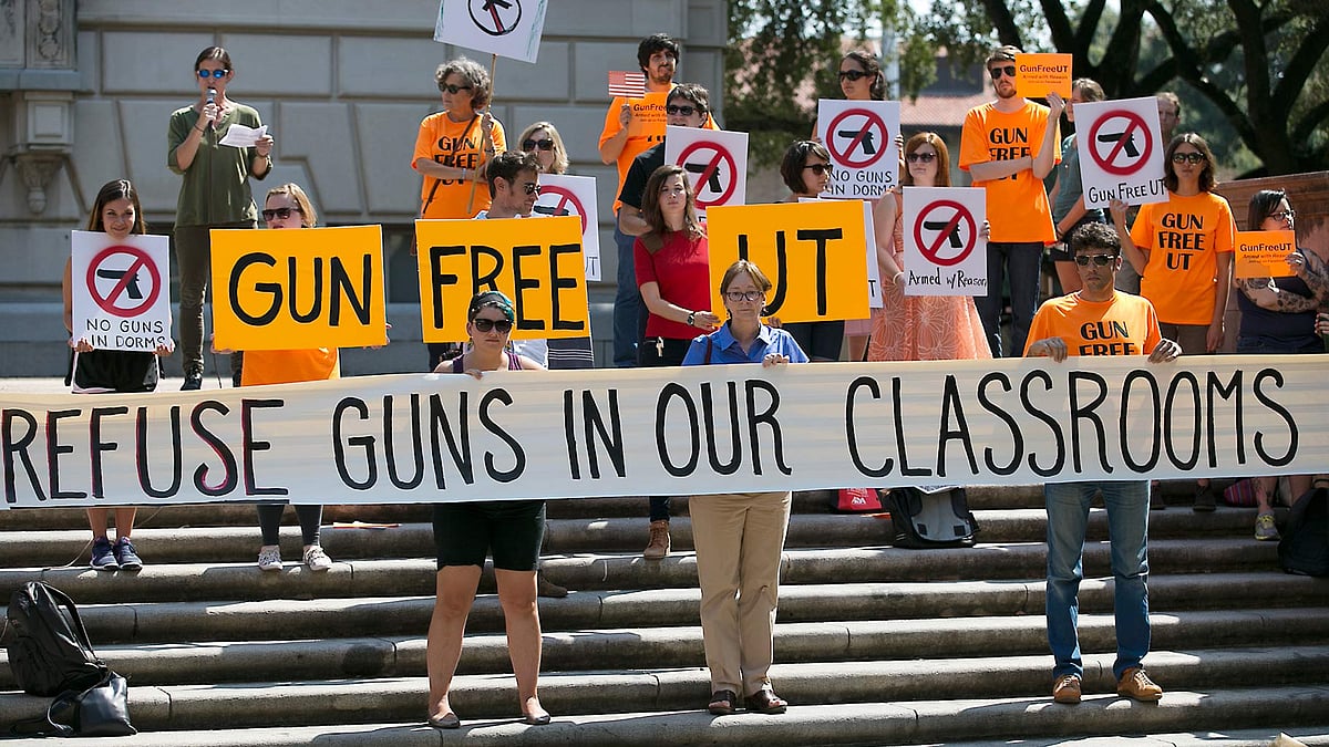 File photo of protesters gathering in the University of Texas campus to oppose a new state law that allows weapons on public college campuses. (Photo: AP)