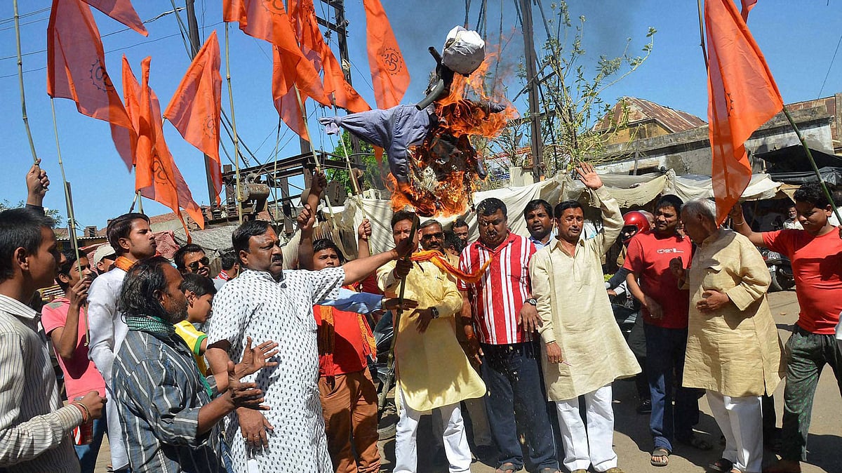 Vishwa Hindu Parishad (VHP) workers burn effigy of AIMIM leader Asaduddin Owaisi for refusing to say `Bharat Mata ki Jai’, in Mirzapur (Photo: PTI)