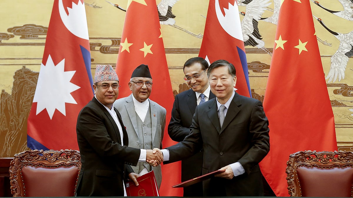 Chinese Premier Li Keqiang, rear right, with Nepal’s Prime Minister Khadga Prasad Oli, rear left, attend a signing ceremony at the Great Hall of the People on Monday, 21 March 2016 in Beijing, China.