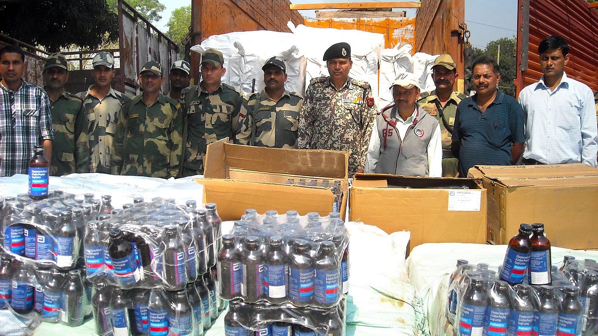 BSF officials present before press cough syrup bottles worth Rs One crore that were seized from Bhagalpur border outpost, near Agartala on 15 March 2015. (Photo Courtesy: IANS)