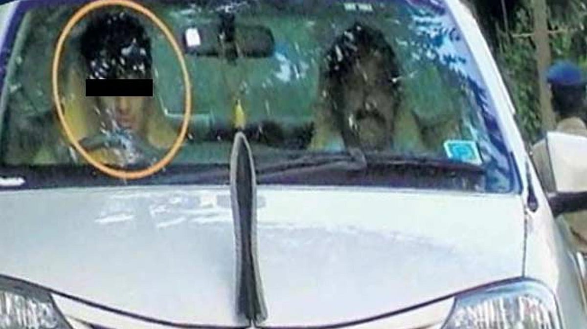 IGP Suresh Rajpurohit’s son driving the police vehicle. (Photo Courtesy: <a href="http://www.dekhnews.com/minor-ig-son-drive-official-car-in-kerala-juvenile-court-orders-registration-of-case-and-probe/">DekhNews</a>)