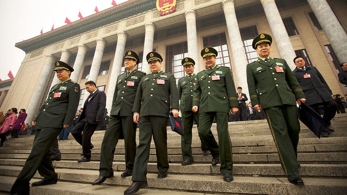 Delegates from the Chinese People’s Liberation Army (PLA) leave the Great Hall of the People in Beijing, Friday, 4 March 2016.  (Photo: AP)