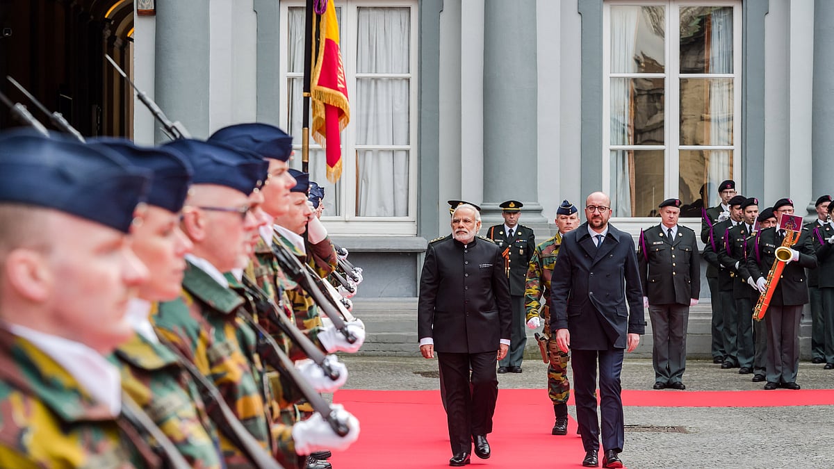 Belgian Prime Minister Charles Michel, right, and Prime Minister Narendra Modi at a ceremonial guard of honour prior to a meeting at the Egmont Palace in Brussels, March 30, 2016. (Photo: AP)