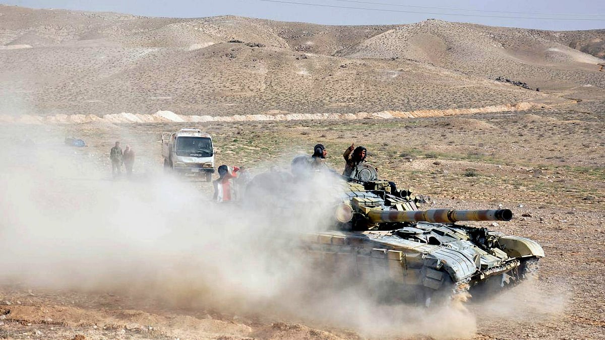 File photo of Syrian government soldiers taking positions near the entrance of Palmyra town. (Photo: AP)