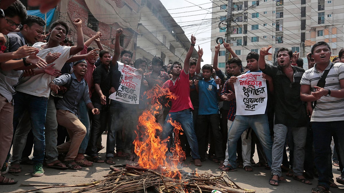  In this 7 April 2016 file photo, Bangladeshi students protest seeking the arrest of three motorcycle-riding assailants who hacked student activist Nazimuddin Samad to death  in Dhaka, Bangladesh. (Photo: AP) 