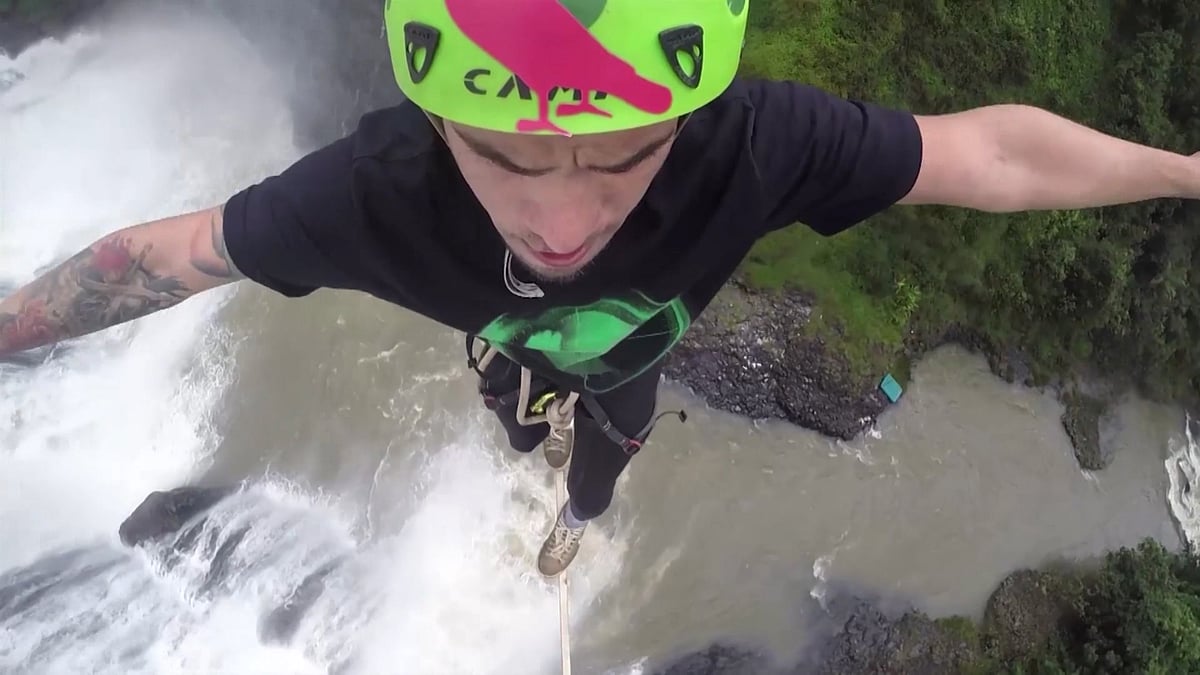 Erick Augusto performed a daredevil stunt on a highline above the Cachoeira Da Fumaca Waterfall in Brazil. (Photo: AP Screengrab)