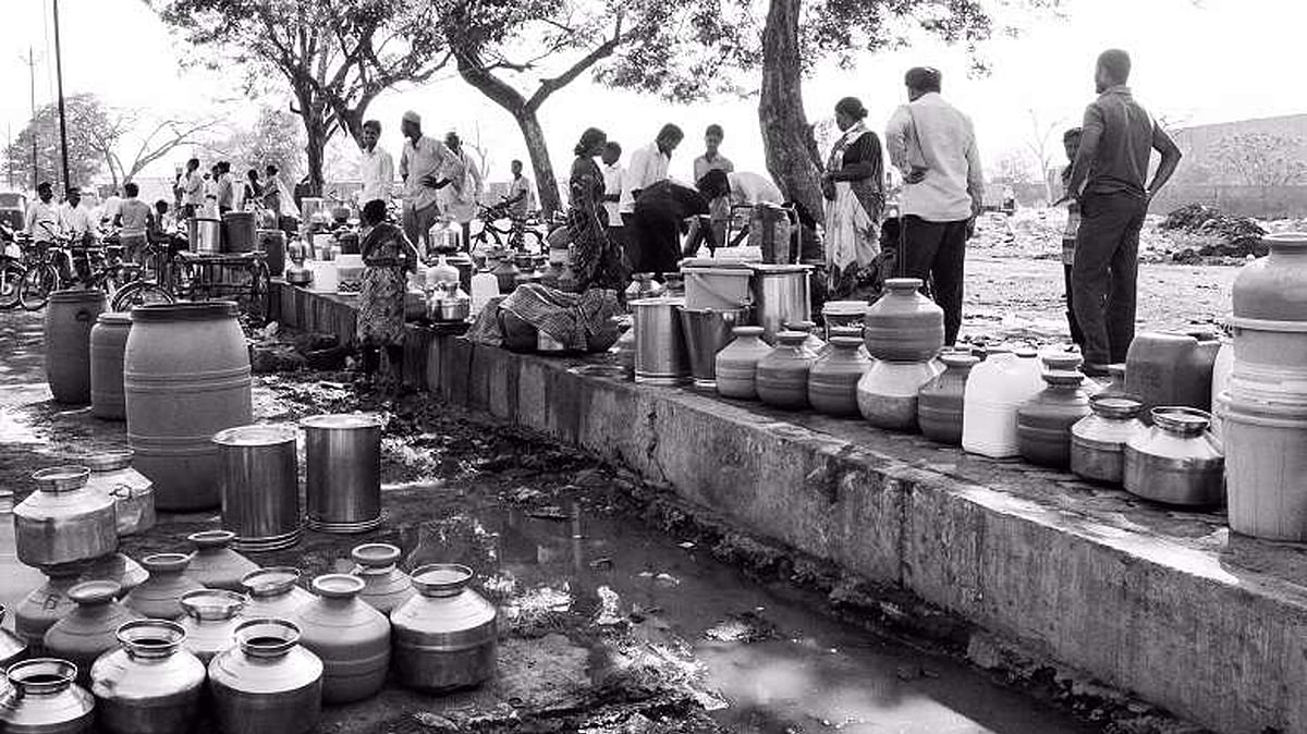 

With taps that have run dry, people crowd around municipal tanks to get water. Many have to wait as long as eight hours in blistering heat to get their fill. (Photo: Ameya Marathe, curated by Nikhil Inamdar)