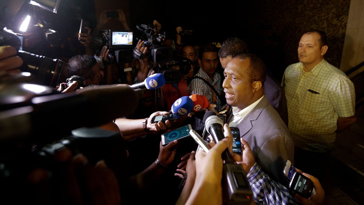 Prosecutor Javier Caraballo talks to the media outside the entrance of the Mossack Fonseca law firm building in Panama City, Wednesday, April 13, 2016.
