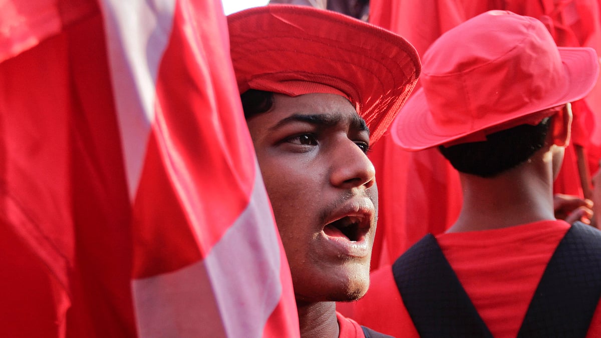 
A cadre of Communist Party of India-Marxist (CPI-M) in red uniform shouts slogans during an election rally in Kolkata. (Photo: AP)     