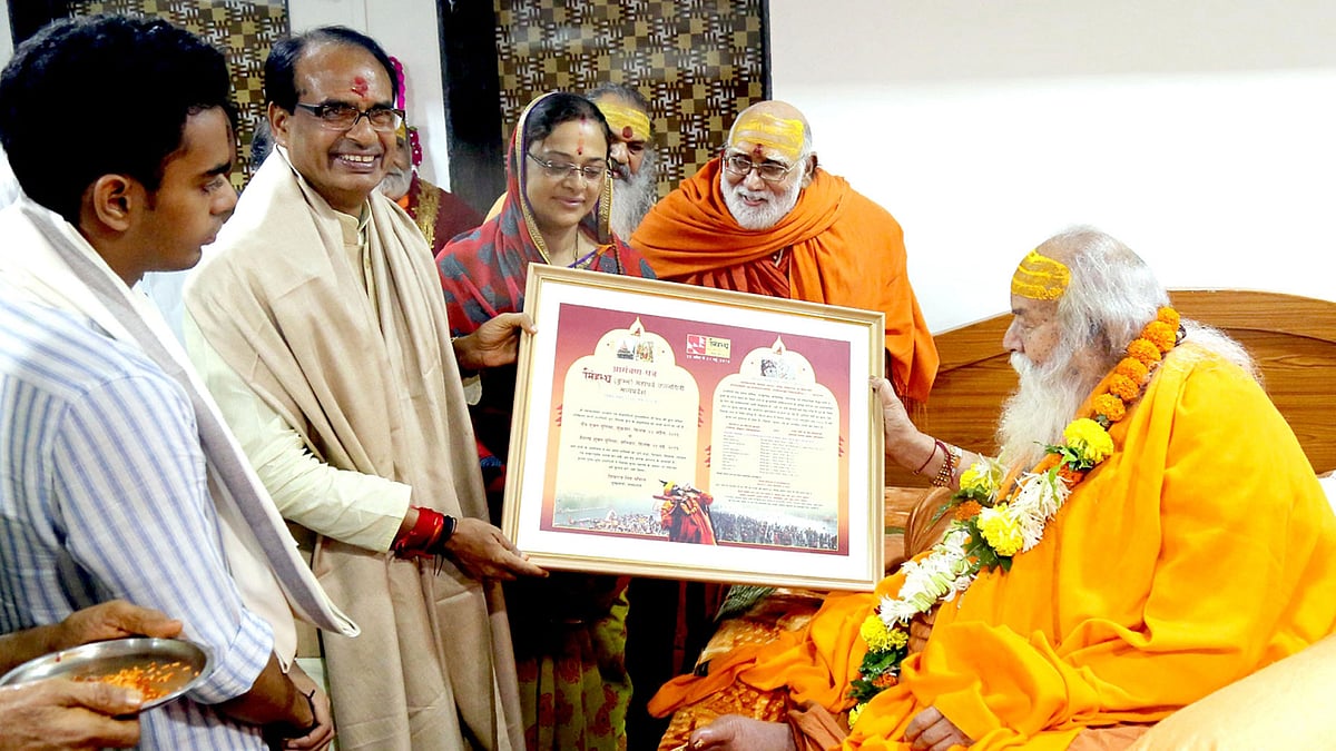 File photo of Shankaracharya with Madhya Pradesh Chief Minister in Nashik. (Photo: IANS)