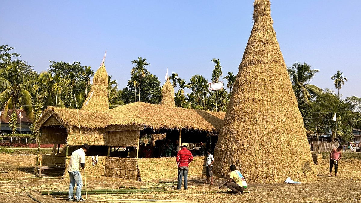 People busy making Maji Ghjar ahead of Bihu at Parbatia in Tezpur of Assam on 12 January 2016. (Photo: IANS)