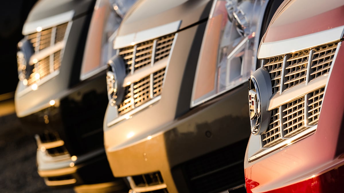 A row of 2012 Cadillac STS sedans on display at a car dealership. (Photo: iStockphoto)