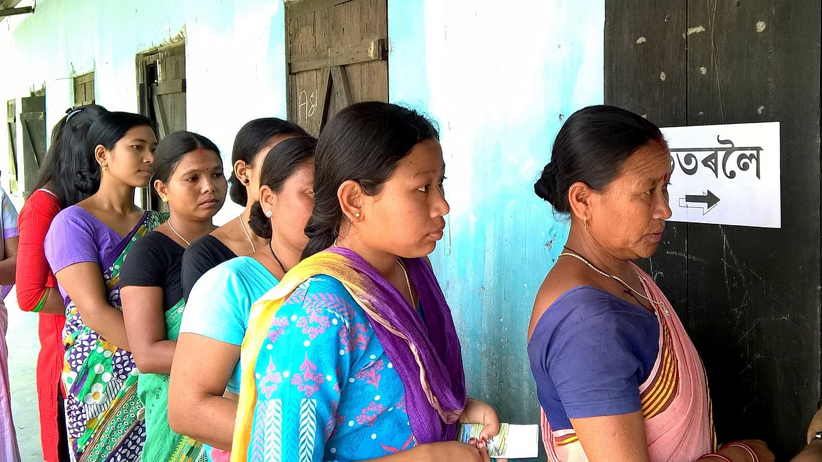 Women wait to cast their votes at a polling booth, during the first phase of Assam assembly elections, in Sonitpur district on April 4, 2016. (Photo: IANS)