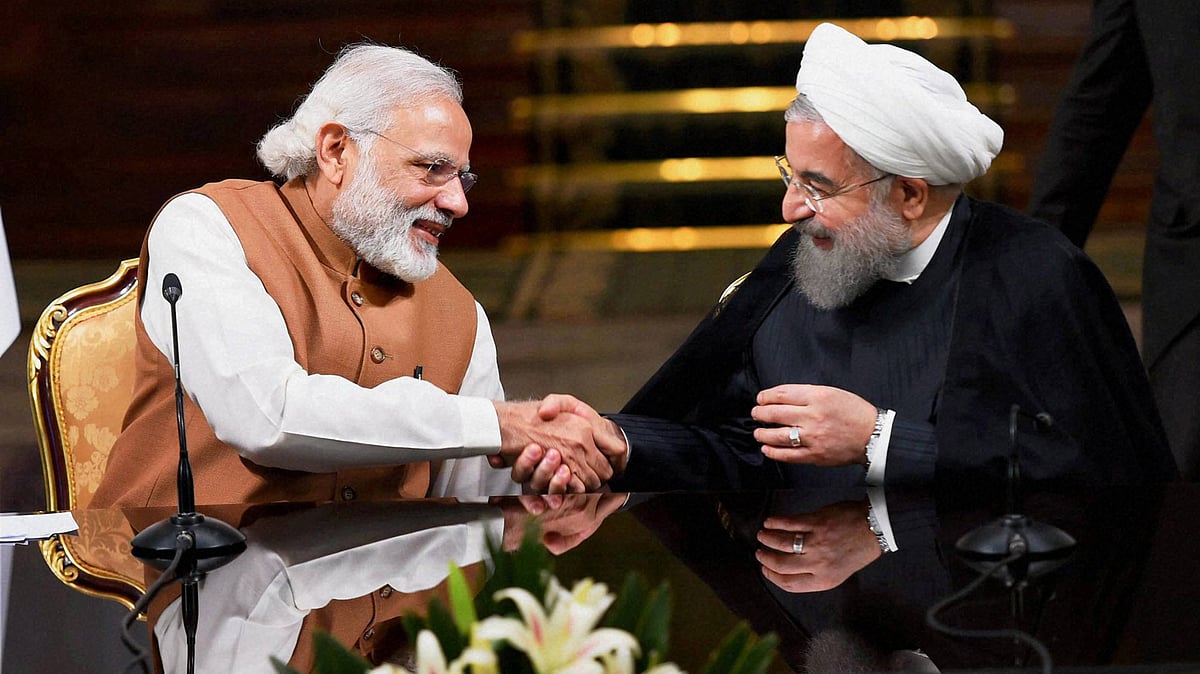 In this photo from 2016, Prime Minister Narendra Modi shakes hands with Iranian President Hassan Rouhan during a joint press conference in Tehran. 