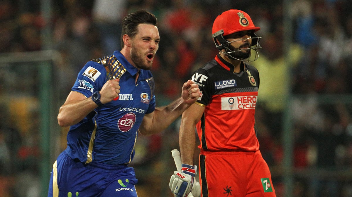 Mumbai Indians’ Mitchell McClenaghan celebrates the wicket of Royal Challengers Bangalore captain Virat Kohli. (Photo: BCCI) 