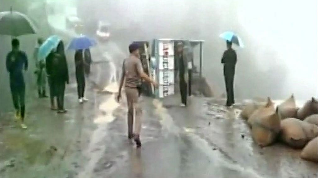 A portion of NH-102 has sunk near Tengnoupal following incessant downpour, vehicles stranded. (Photo: ANI screengrab)