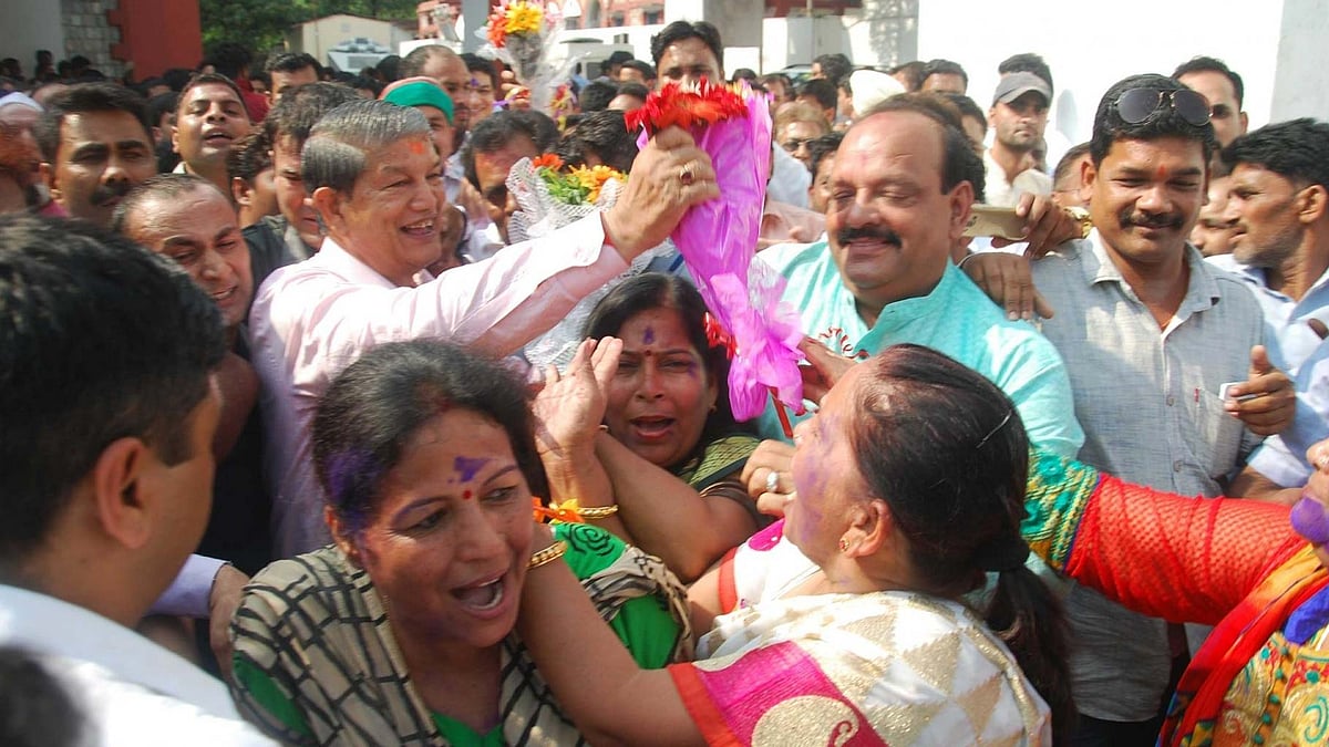 Ousted Uttarakhand Chief Minister Harish Rawat celebrating in Dehradun his legislative majority was proved on 11 May 2016. (Photo: IANS)