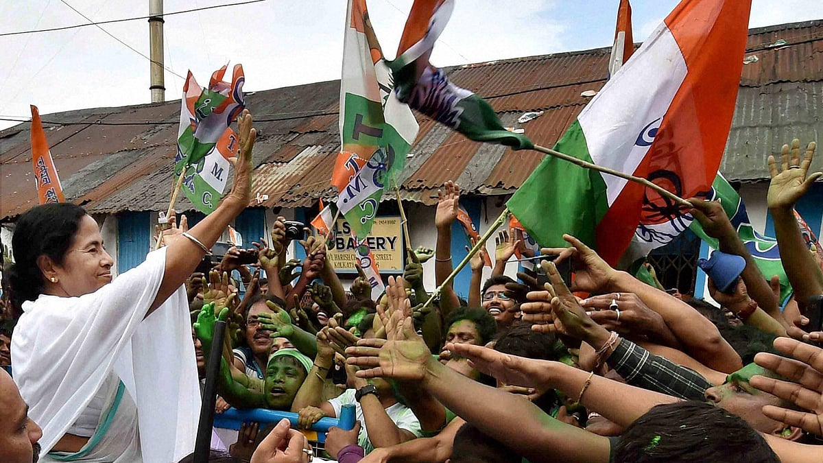 West Bengal CM Mamata Banerjee waves at supporters after her party’s thumping win in the state assembly elections, in Kolkata on Thursday. (Photo: PTI)