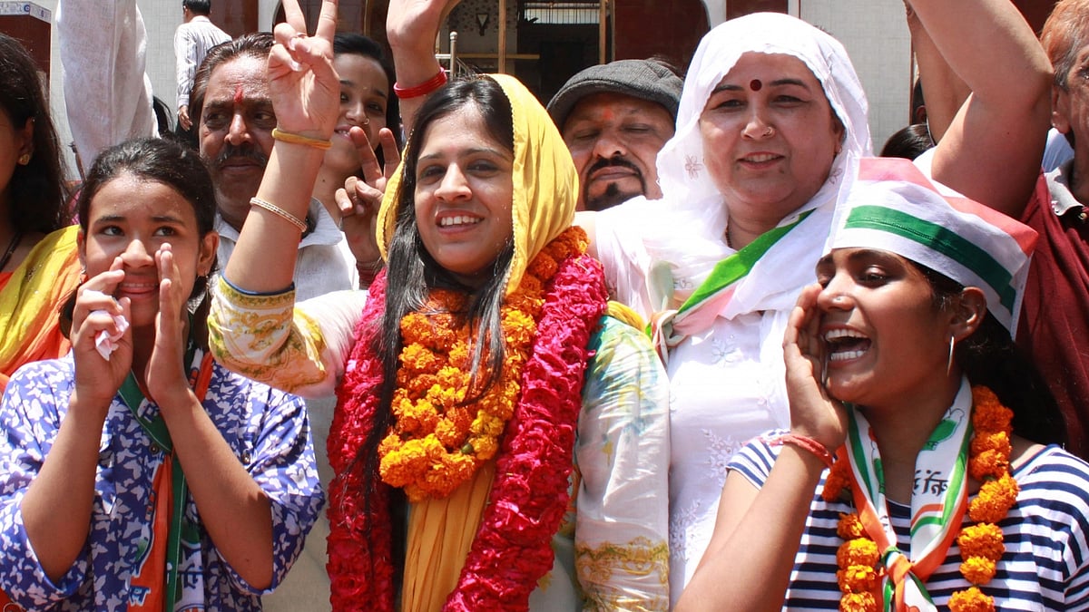 Congress candidate Yogita Rathi celebrates her victory from Munirka in the MCD bypolls. (Photo: IANS)