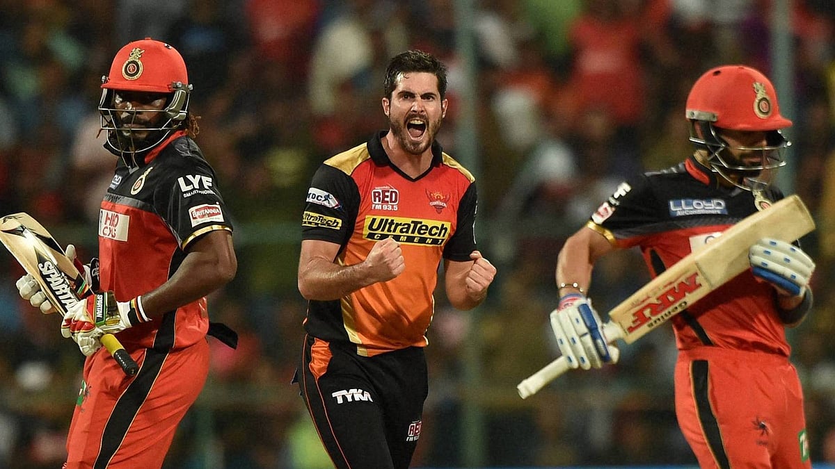 Ben Cutting celebrates after taking the wicket of Chris Gayle. (Photo: PTI)