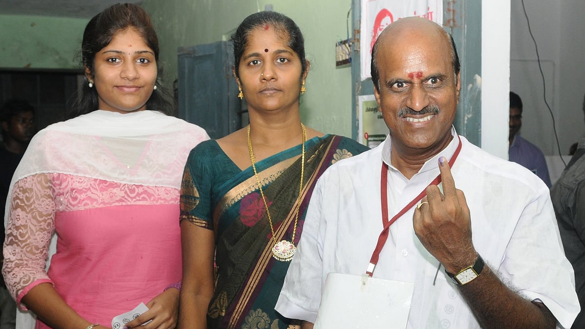  A man shows his forefinger marked with phosphorous ink after casting vote, at a polling booth, during the Puducherry Assembly Election, on 16 May  2016.(Photo: IANS)