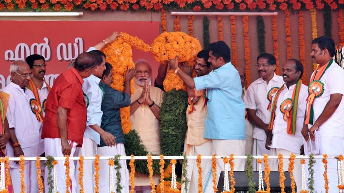 Narendra Modi being felicitated at a BJP event in Palakkad, Kerala. (Photo Courtesy: Twitter/Narendra Modi)