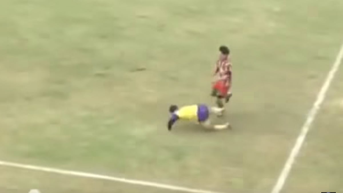 Michael Favre (left) falls on the field. (Photo: YouTube Screenshot)