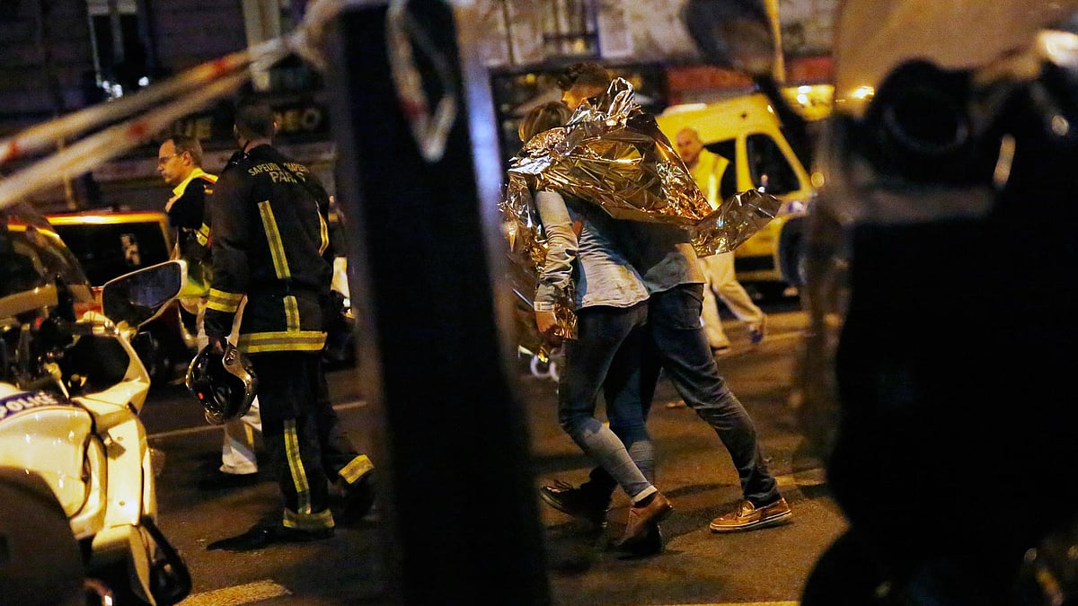 A person being evacuated after a shooting outside the Bataclan theatre in Paris in November 2015. (Photo: AP)