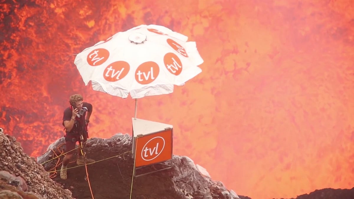 Chris Horsley was seen strolling around 
on a narrow ledge above an active volcano while appearing to wait for a 
phone call. (Photo: AP screengrab)