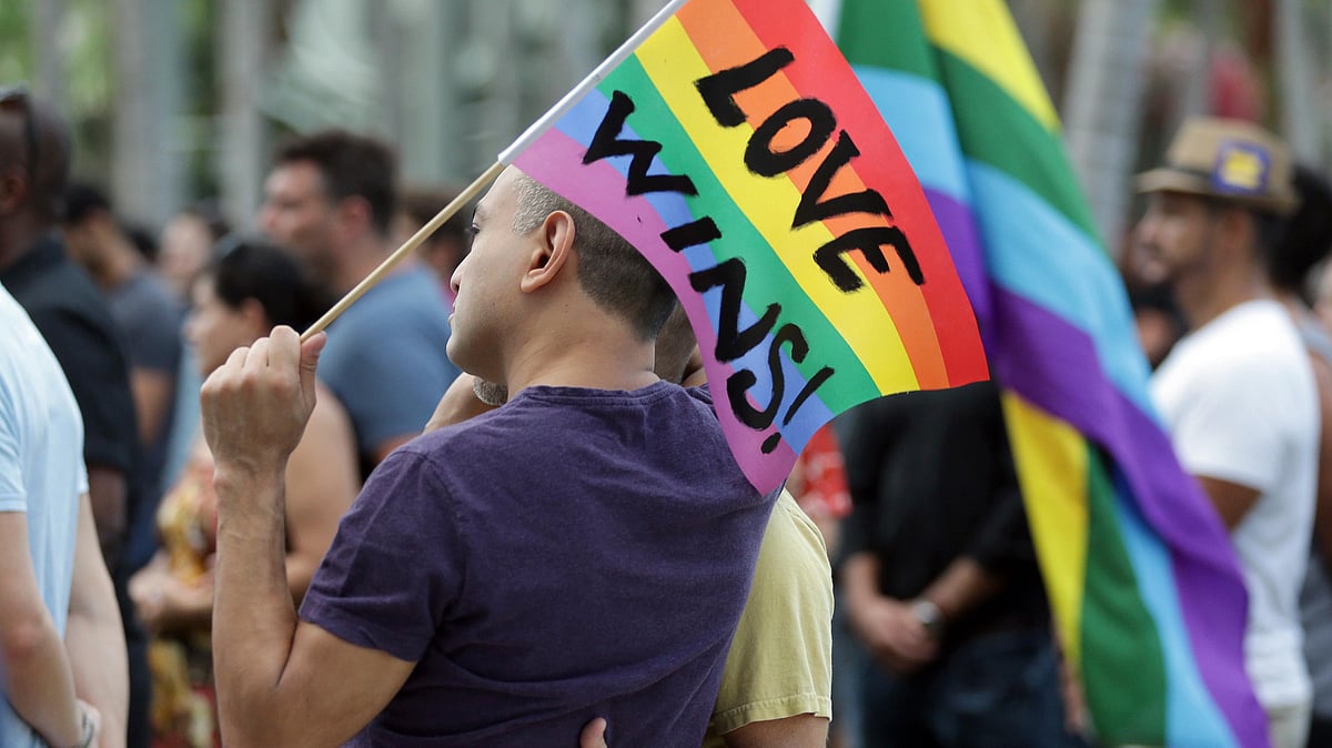 

Juan Mantilla, 42, of Miami Beach, Florida (left) stands with his partner during a vigil in memory of the victims of the Orlando mass shooting. (Photo: AP)