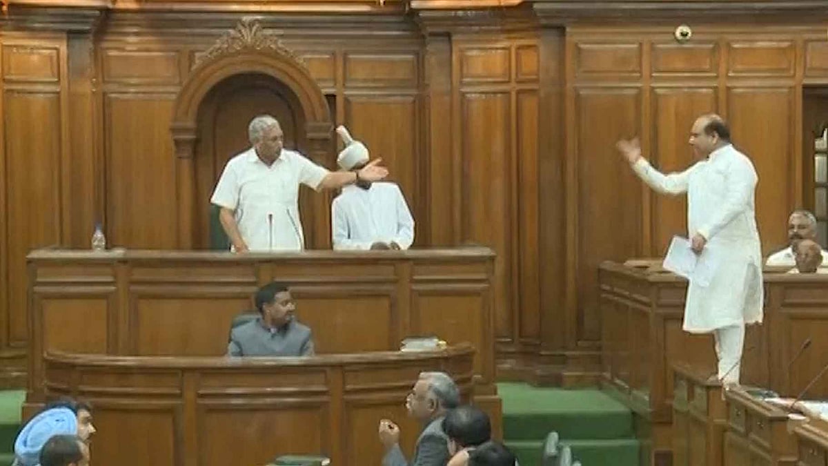BJP MLA standing on the bench in Delhi Assembly. (Photo: ANI Screengrab)