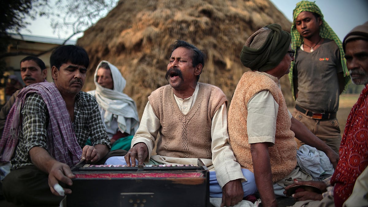 A singer performs traditional Baul songs in a village in Uttar Pradesh. 