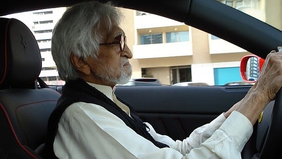 MF Husain driving his Ferrari.