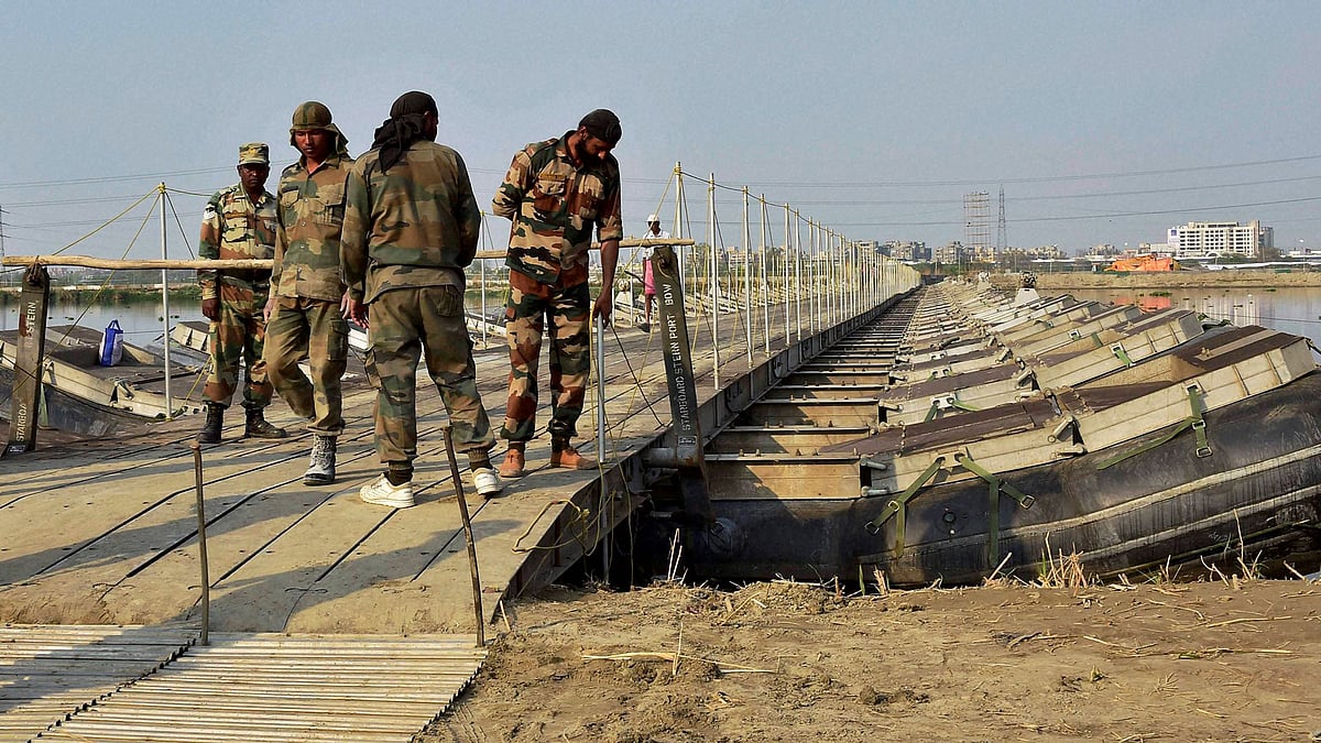 Army personnel construct temporary bridges over Yamuna river for the three-day World Peace Festival organised by Sri Sri Ravi Shankar (Photo: PTI)