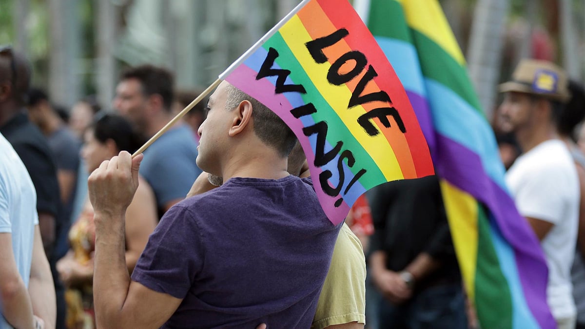 Juan Mantilla (42) of Miami Beach, Florida  stands with his partner during a vigil in memory of the victims of the Orlando mass shooting. (Photo: AP)