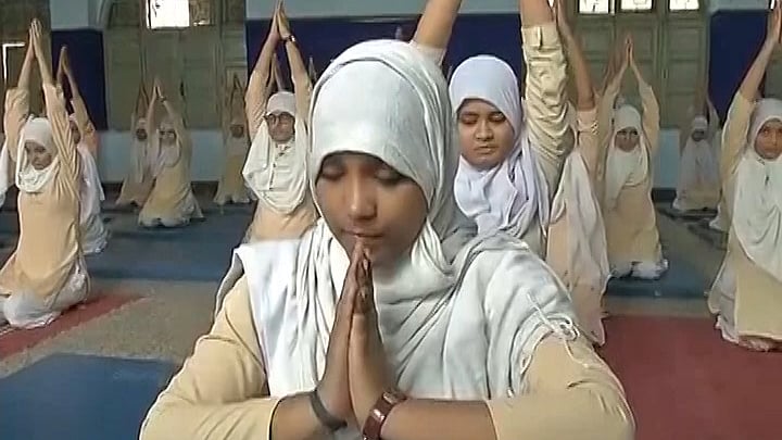 Girls practise yoga to stay healthy and observe International Yoga Day (Photo: ANI Screengrab)