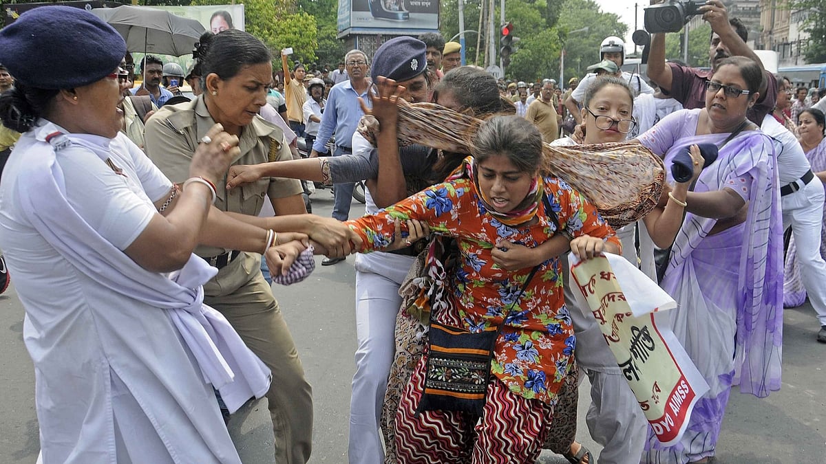 SUCI workers stage a demonstration against the rape of a 25-year-old woman in Kolkata’s Salt Lake, May 31, 2016. (Photo: IANS)