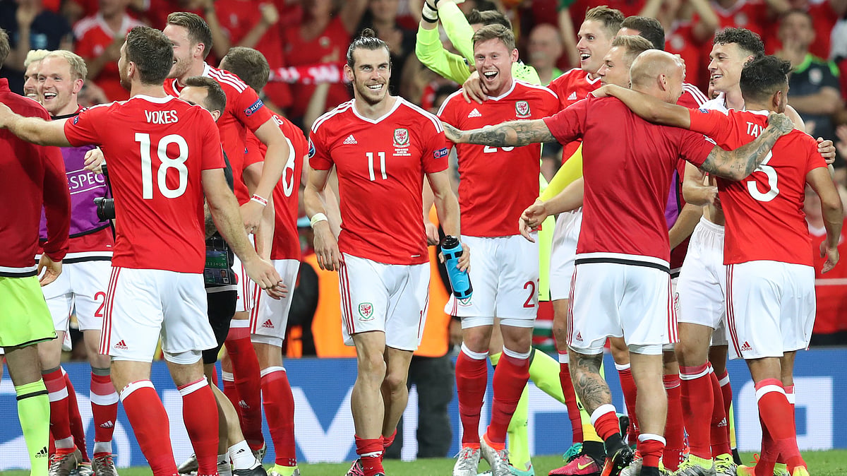 Gareth Bale celebrates with his teammates after Wales beat Russia on Monday. (Photo: AP)