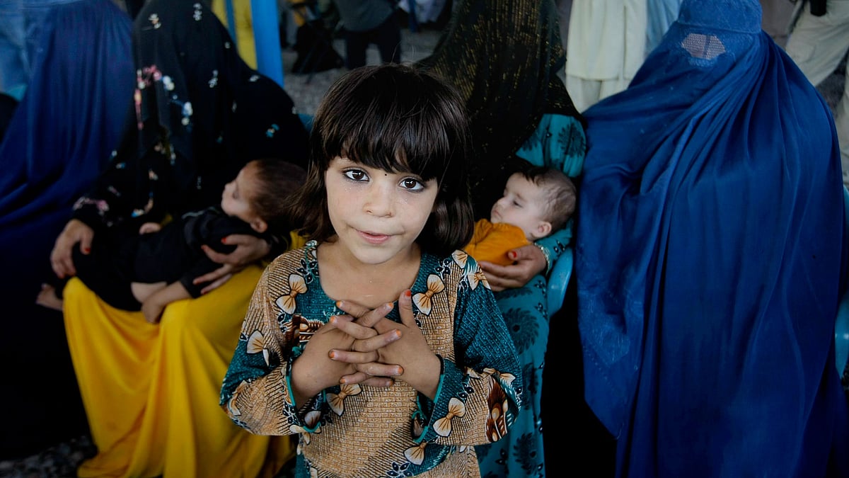 Afghan refugees wait for their documents to go back to Afghanistan at the UNHCR’s Repatriation Center in Pakistan. (Photo: AP)