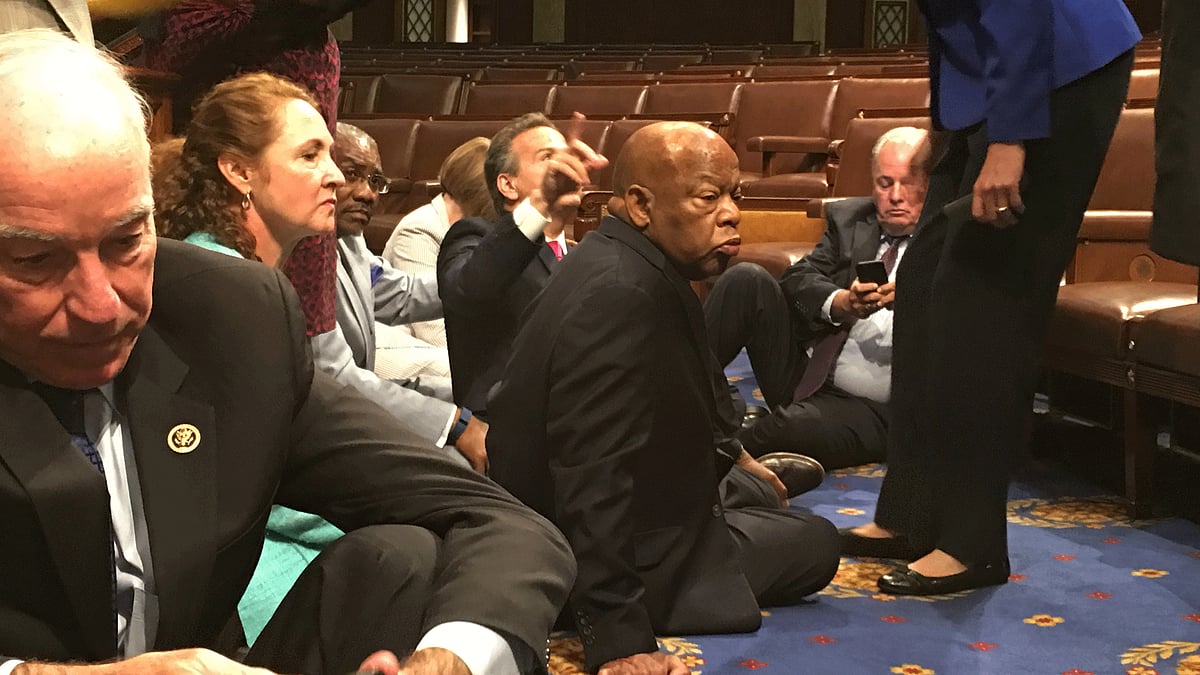 Democrat members of Congress participate in a sit-in, seeking a vote on gun control measures. (Photo: AP)