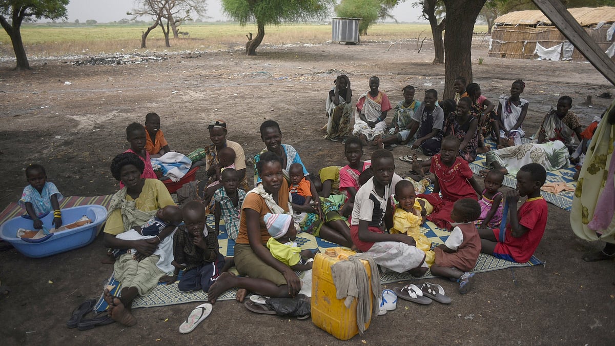 Mothers sit with their children waiting to receive malnutrition assistance in the Nile west bank village of Lul South Sudan’s Upper Nile state. (Photo: AP)