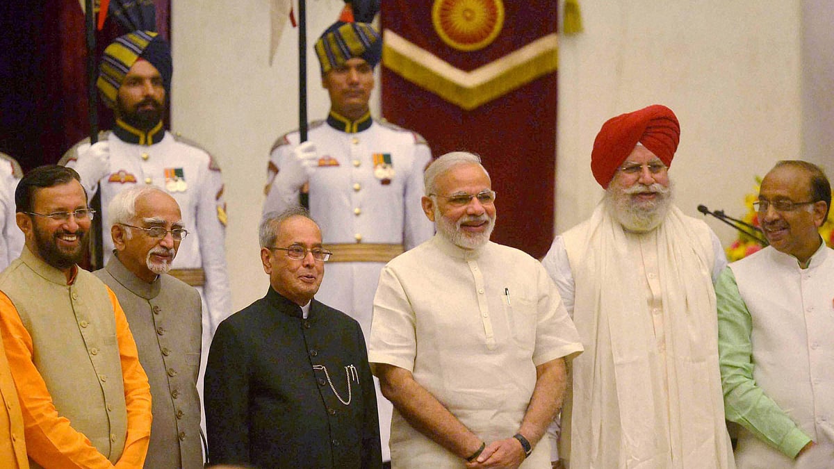 President Pranab Mukherjee, Vice President Hamid Ansari and Prime Minister Narendra Modi during swearing ceremony. (Photo: PTI)