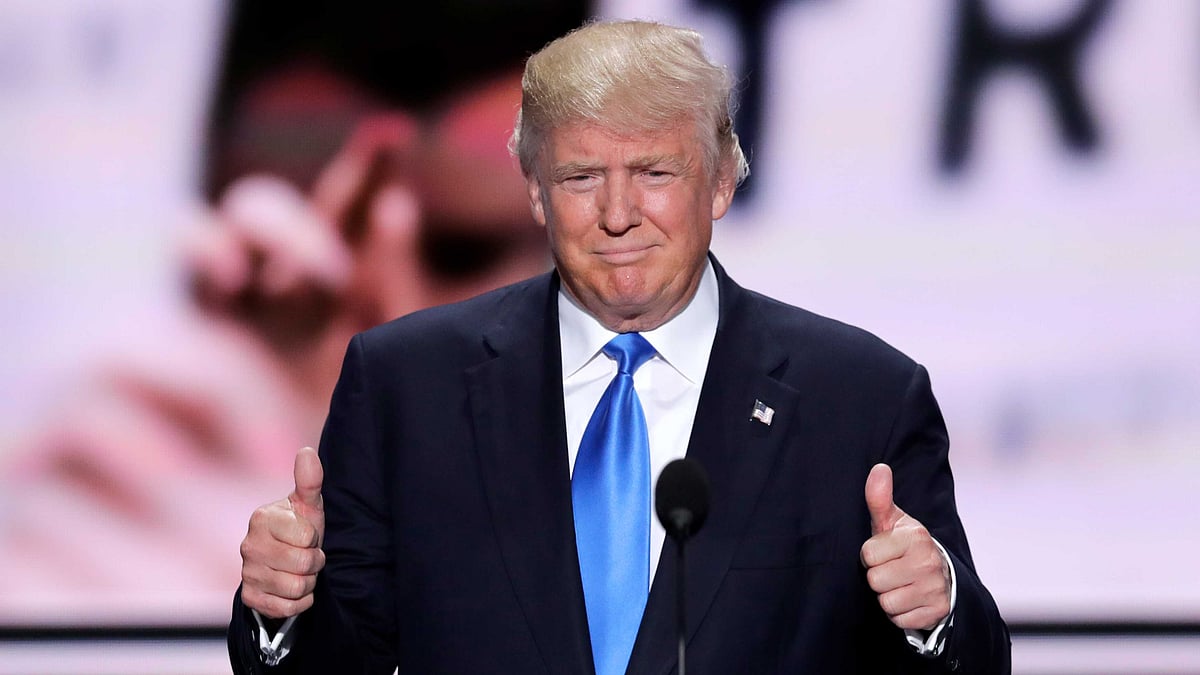 Donald Trump flashes two thumbs up as he introduces his wife Melania during the opening day of the Republican National Convention. (Photo: AP)
