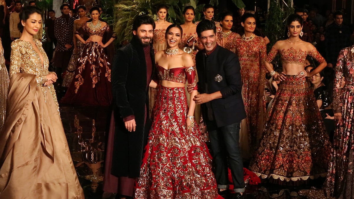 Deepika Padukone, Fawad Khan, and Manish Malhotra on the first day of the fashion week. (Photo: <b>The Quint</b>)