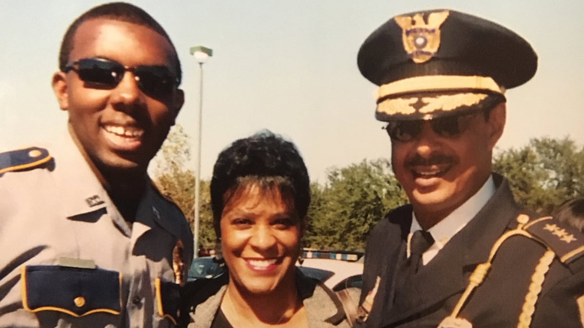 Baton Rouge Police Officer Montrell Jackson, from left, his aunt Darlene Cavalier and former Baton Rouge Police Chief Jeff LeDuff pose for a photo at a graduation ceremony. (Photo : AP) 