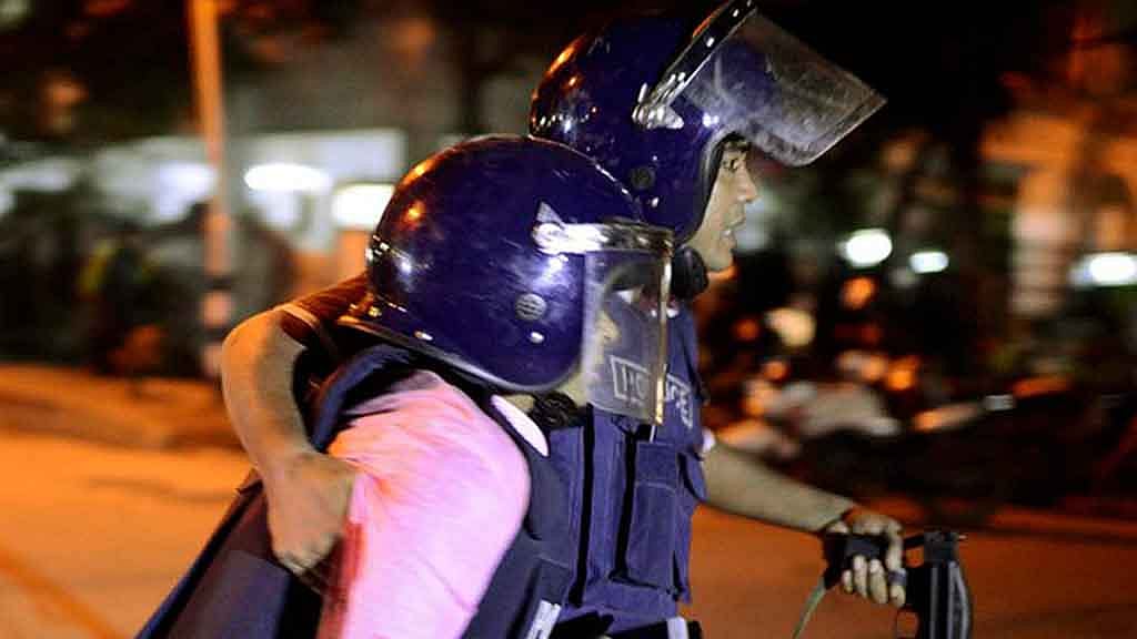 Unknown security personnel being taken for medical attention. (Photo: AP screengrab)