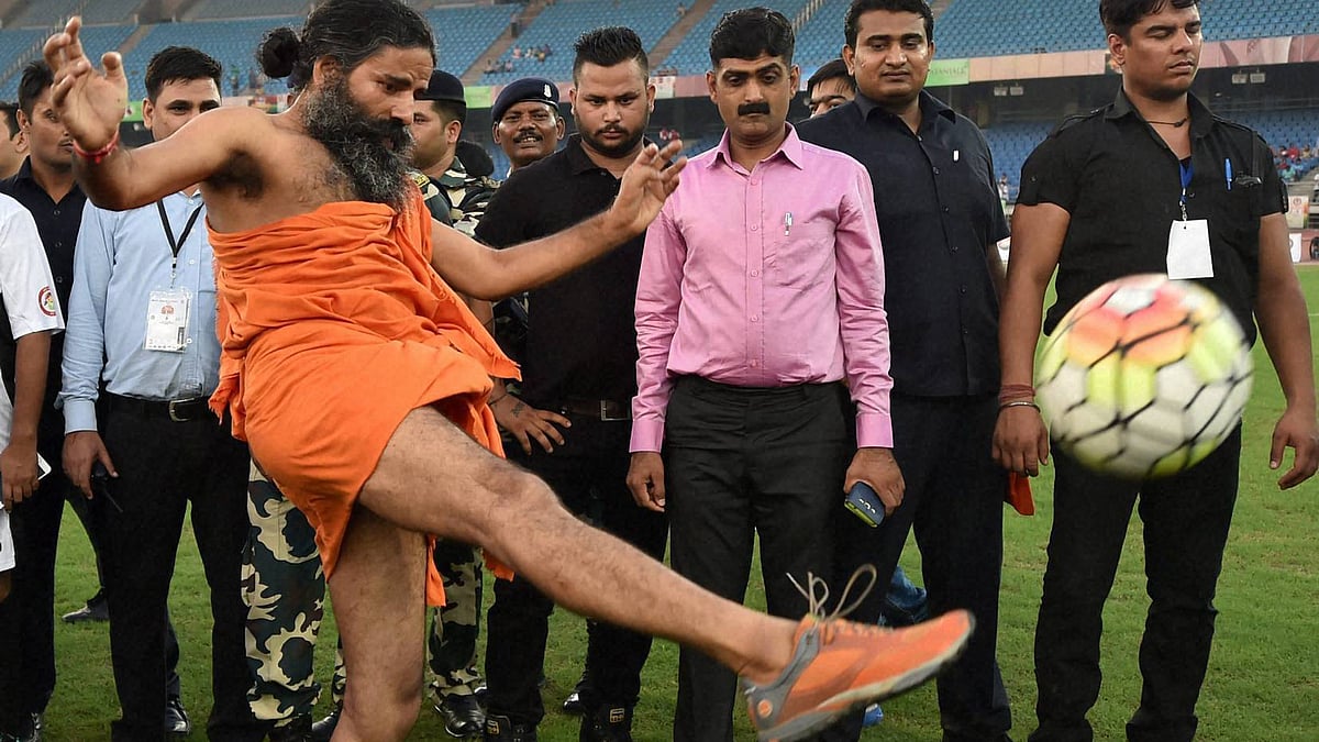 Baba Ramdev plays football to promote Prime Minister Narendra Modi’s pet projects (Photo: IANS)