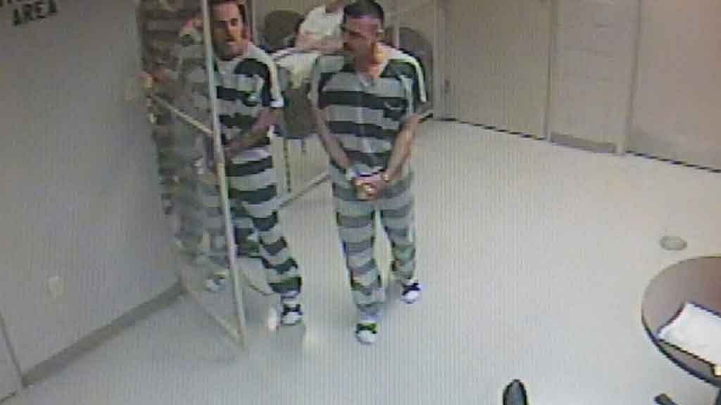The inmates yelled for help, banged on doors and broke through the cell door to save the jailer. (Photo: AP screengrab)