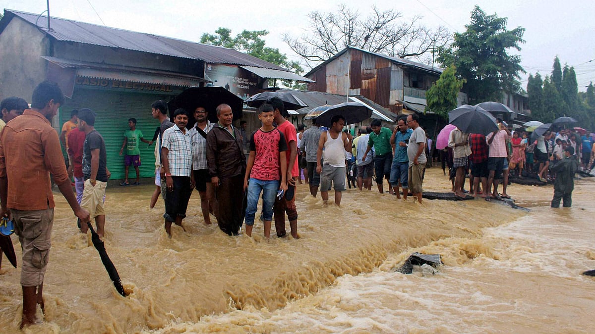 Indo-Bhutan Asian highway overflows with flood water at Banarhat in Jalpaiguri District on Sunday. (Photo: PTI)