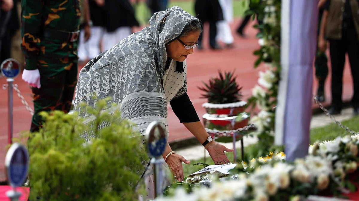 Bangladesh Prime Minister Sheikh Hasina paying tribute to victims of Dhaka attacks. (Photo: AP)